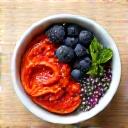 Vibrant bowl of gut-healing foods like kimchi and berries