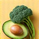 Plate with hormone-supporting foods like flax seeds and leafy greens